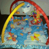 Развивающий музыкальный коврик с порхающей птичкой Fisher Price